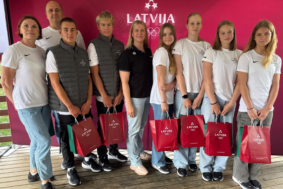 Hera Serxane of the Vernon Kokanee Swim Club, 15, (fourth from right) joins her teammates and coaches for the Team Latvia group photo. Serzane, born in Latvia, competed for her birth country at the European Youth Olympic Festival in North Macedonia.