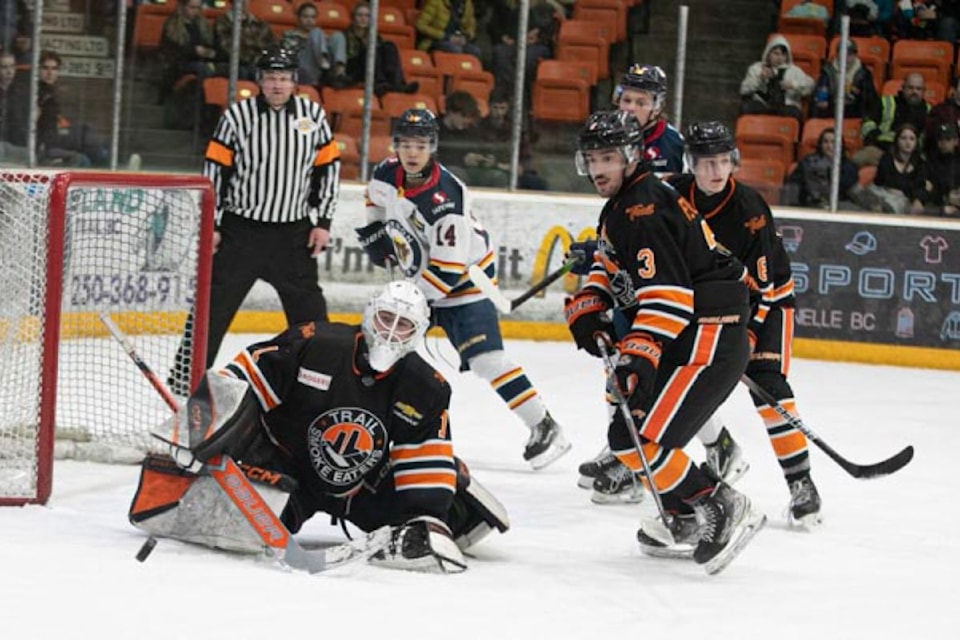 Trail Smoke Eaters goalie Ryan Parker makes the save with teammate Isaac Fecteau (3) in pursuit of the loose puck during the Smokies' 8-3 BCHL win over the visiting Vernon Vipers Saturday, Feb. 1, at Cominco Arena.