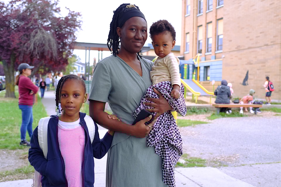 Estaher, starting kindergarten, is accompanied by her mother and sibling on her first-ever day at school at George Jay Elementary on Sept. 3, 2024.