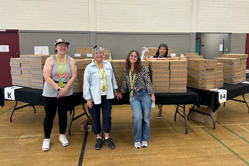 Volunteers prepare for the crowds at Mustard Seed's Fair Start for Kids event.