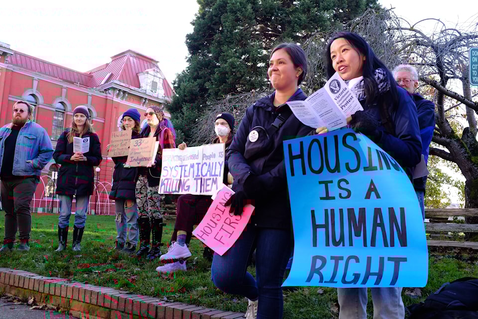 Protesters gathered at Victoria's Centennial Square to condemn municipal sheltering bylaws as "forced displacement" targeting homeless people downtown. (Olivier Laurin / Victoria News)