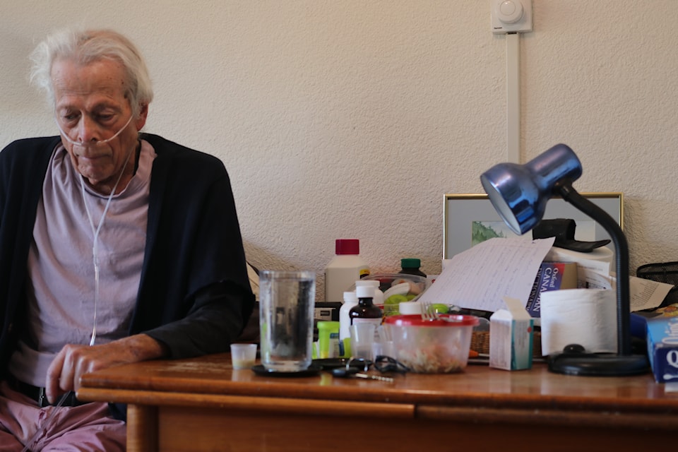 Tom Kershaw, a recipient of More Than Meals, sits in his apartment.