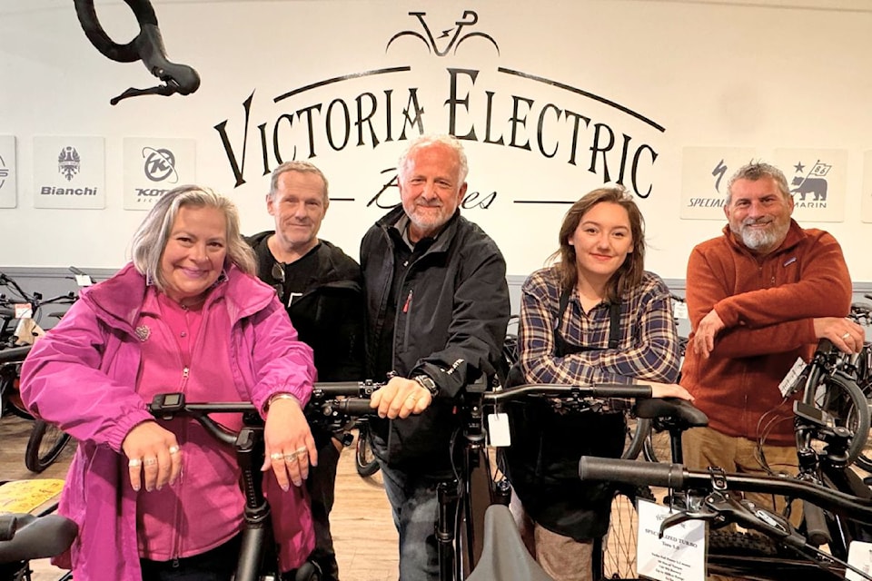 Michael Erlanger, founder of Ride it Forward, standing in between (from left) Samantha Rubin of Greater Victoria SD61, Dan Tombs, Alexandra Robertson and Charles Turner of Victoria Electric Bikes.