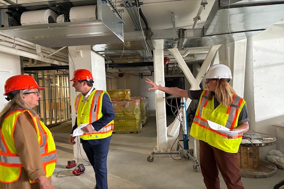 Minister of Tourism Lana Popham and Minister of Transportation Rob Flemming touring Belleville Terminal's temporary replacement offices and boarding area
