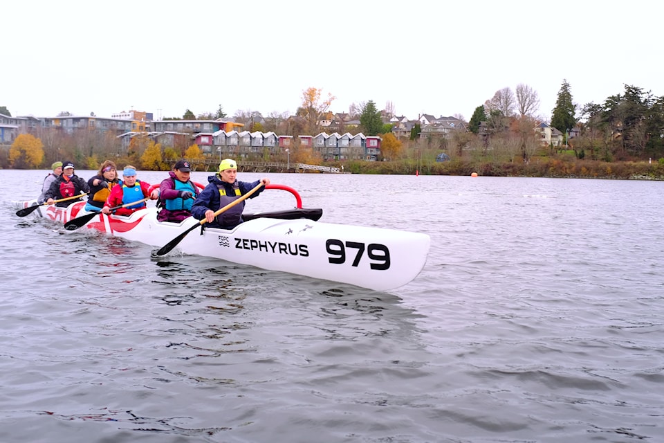 A canoe crew approaches the dock at Fairway Gorge Paddling Club, preparing to compete in this year's Wetdashe.