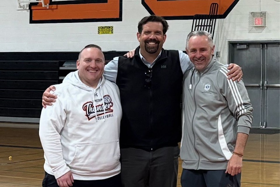Spectrum's vice-principal Phil Ohl (middle) poses with athletic directors Johann Cherry (left) and Dominic Butcher.