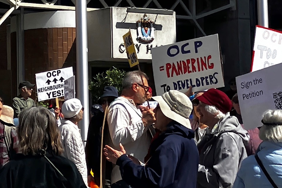 Members of the James Bay Coalition, Victoria Tenants Union and others rally at Victoria city hall on Thursday to protest the draft official community plan they say is developer-friendly and tenant-hostile.