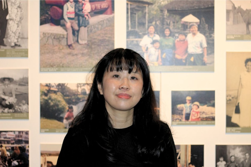 Dr. Melissa Karmen Lee, CEO of the Chinese Canadian Museum stands in the Royal BC Museums new Odysseys and Migration Exhibit.