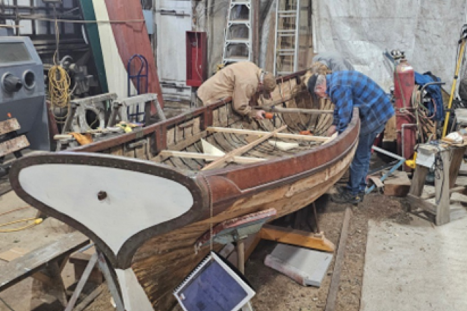 In the Ladysmith Maritime Society workshop with the Royal Navy skiff-dinghy. 