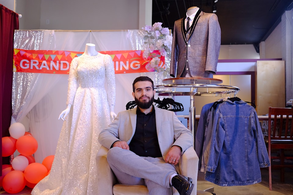 Ala Alhaj Obid, 21, hailing from Syria, sits in his newly opened tailoring shop, D&F Tailoring Experts, at 543 Herald St. 