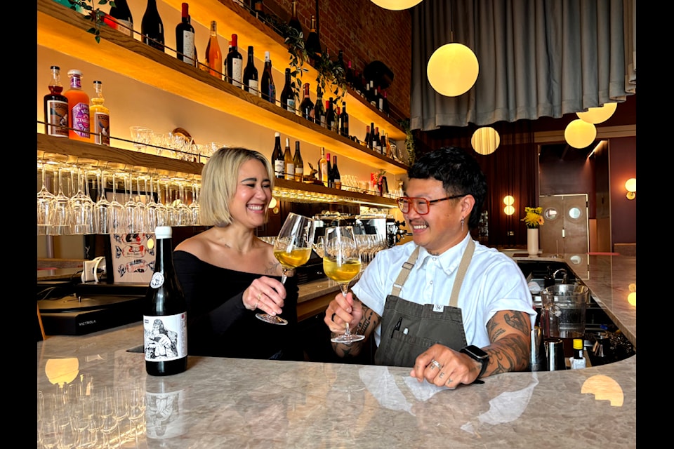 Sydney Cooper and Billy Nguyen, Rabbit Rabbit's sommelier and executive chef, have a drink at the bar.