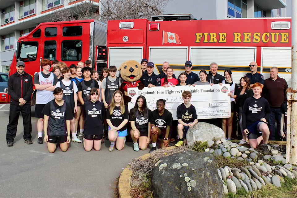 Students from Esquimalt High School gather with the presentation cheque towards the new field. 