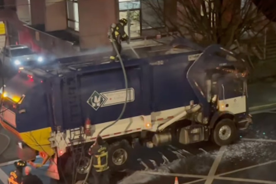 Firefighters douse a Victoria garbage truck fire on Jan. 23  around 6 a.m.