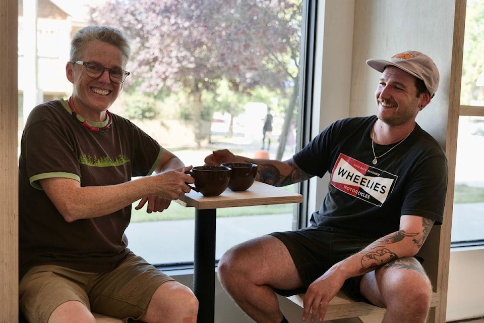 Jenny Farkas (left), and Dan Hewson sit on the newly formed bench space in MakeSpace's cafe. 
