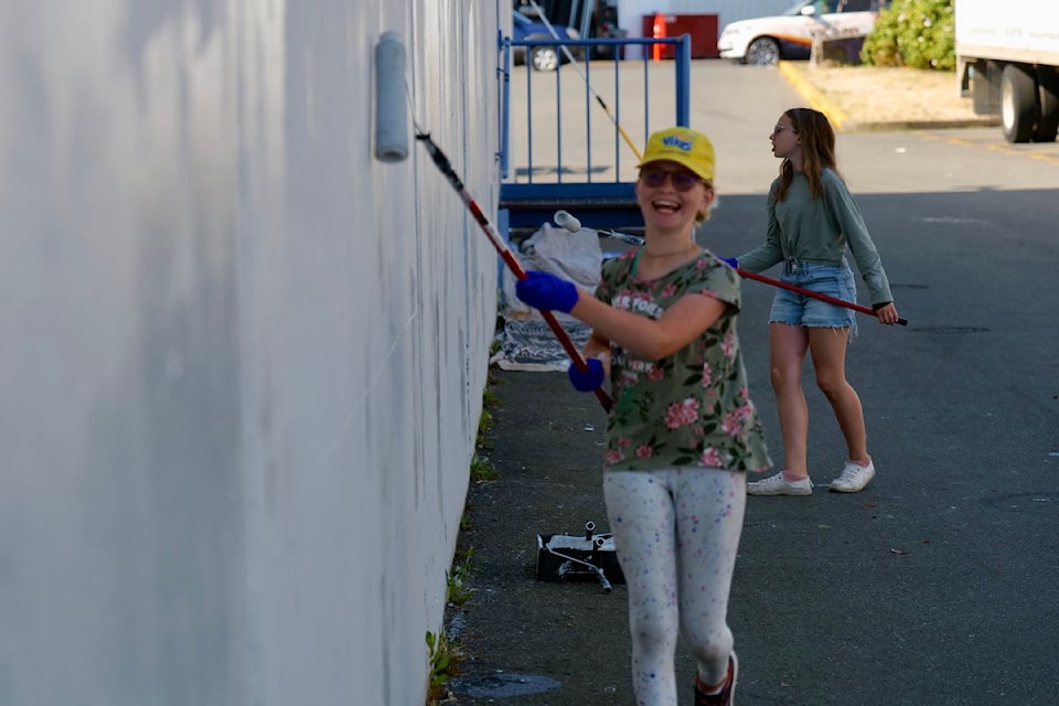 Volunteers of all ages turned out Thursday, aiming to make their mark by revitalizing tagged walls.