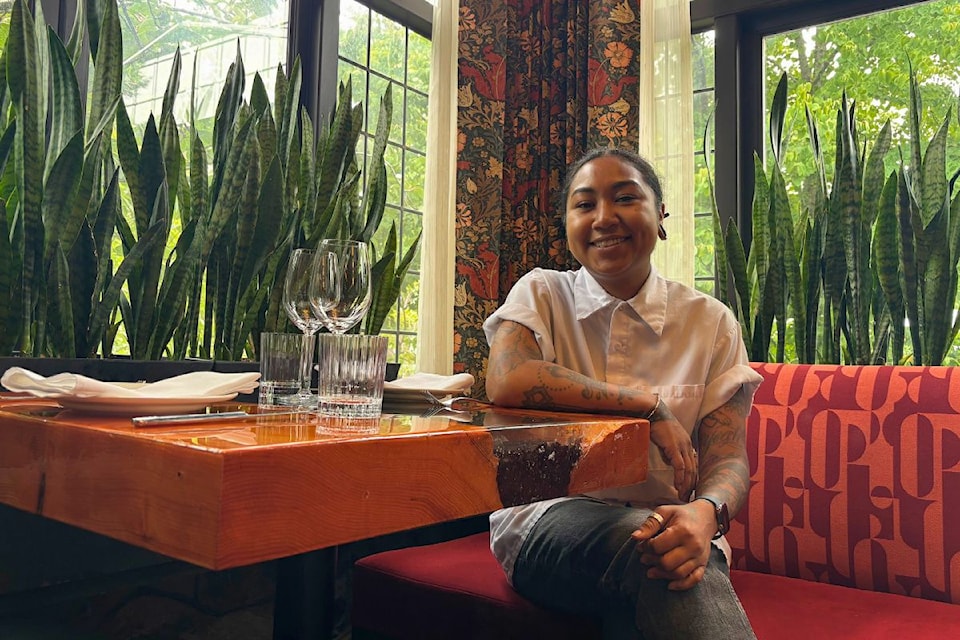 Andrea Alridge sits in Janevca Kitchen and Lounge.