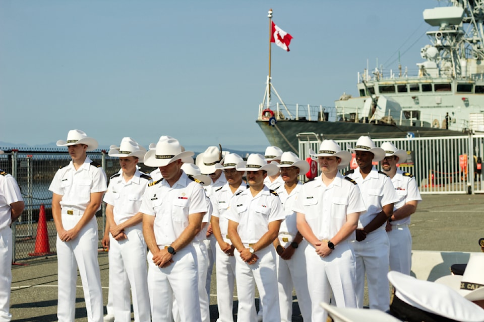 Crews stand in front of the HMCS Vancouver at ogden point for the 30th anniversary of the HMCS Calgary.