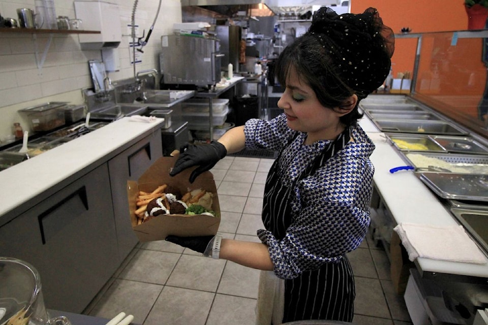 Aylar Ebrahimi serves up falafel to go.