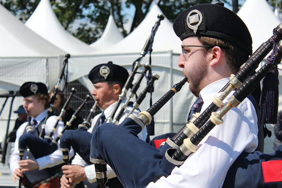 A member of Simon Fraser University's pipe band blows on his bagpipe.