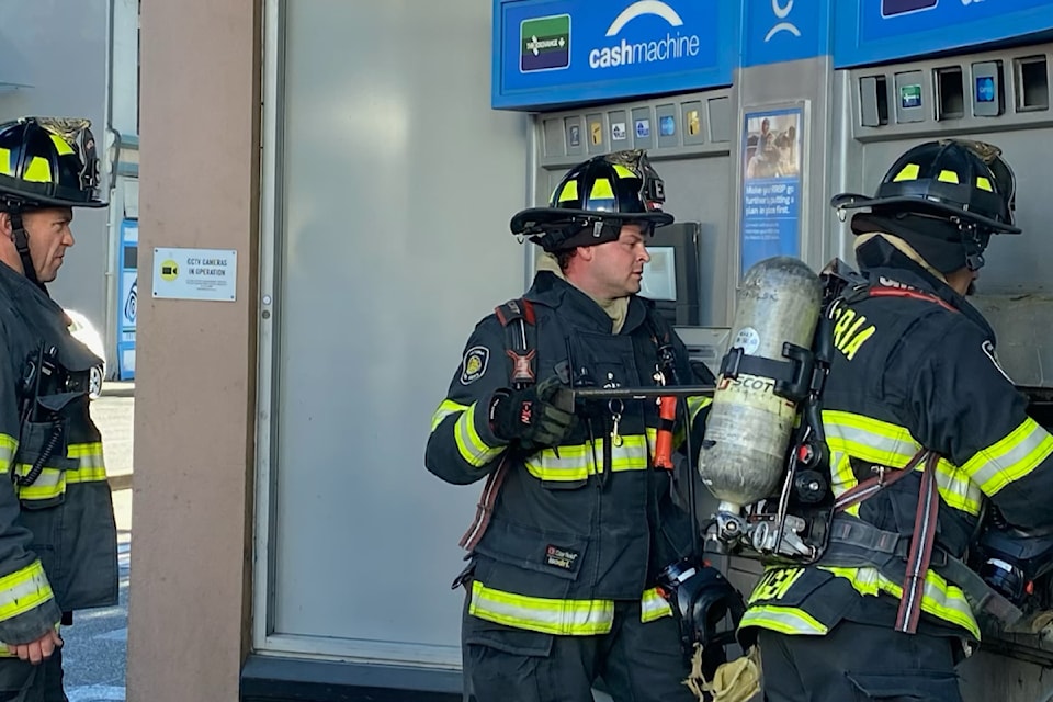 Firefighters deal with an ATM fire in downtown Victoria on Tuesday (May 27). 