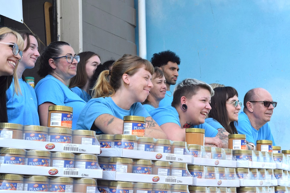 Merry Maids' hard-working employees helped collect the 5,650 peanut butter jars.