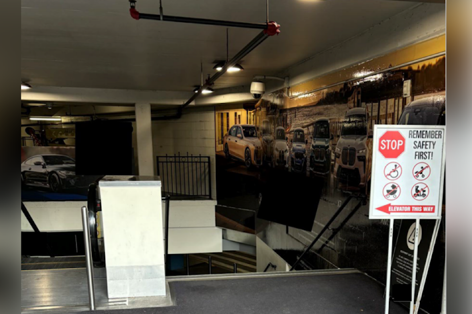 Signage above an escalator that took the life a shopper in November 2024.