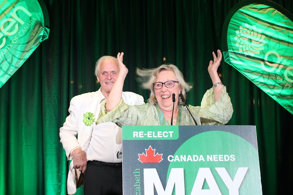 Green Party leader Elizabeth May celebrating her projected win with her husband John Kidder.