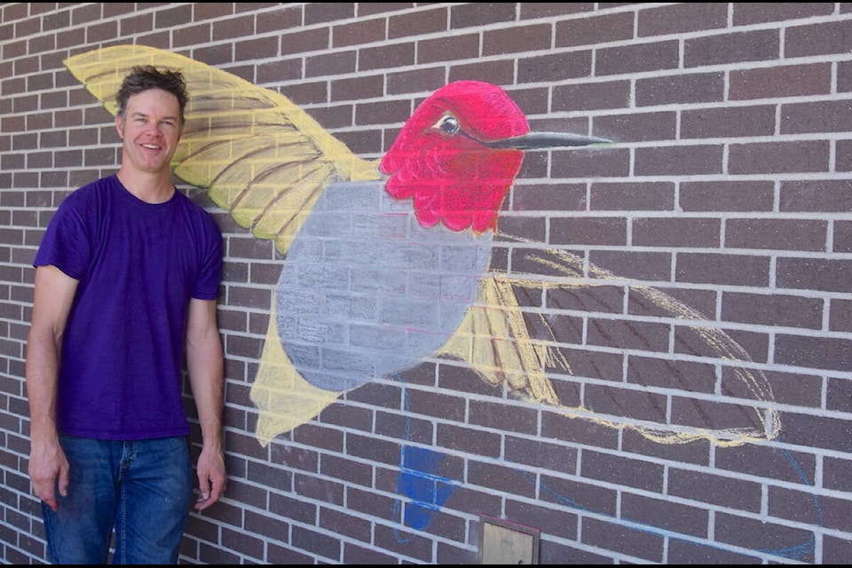 Multidisciplinary artist and Township Community Arts Council Chalk Party organizer Scott Gillies shows off his 3D art at the 2023 event Sunday (July 16). (Brendan Mayer/News Staff) 