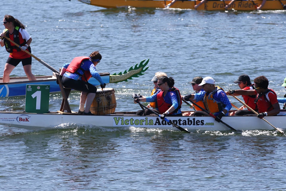Dragon boaters paddle toward the finish line Saturday, Aug. 12, during the Canada Dry Victoria Dragon Boat Festival in Victoria’s Inner Harbour. (Justin Samanski-Langille/News Staff) 