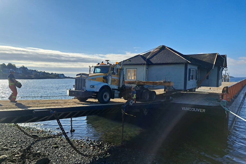 Two houses move out of Oak Bay and Victoria via barge. (Jim Connelly/Nickel Bros) 