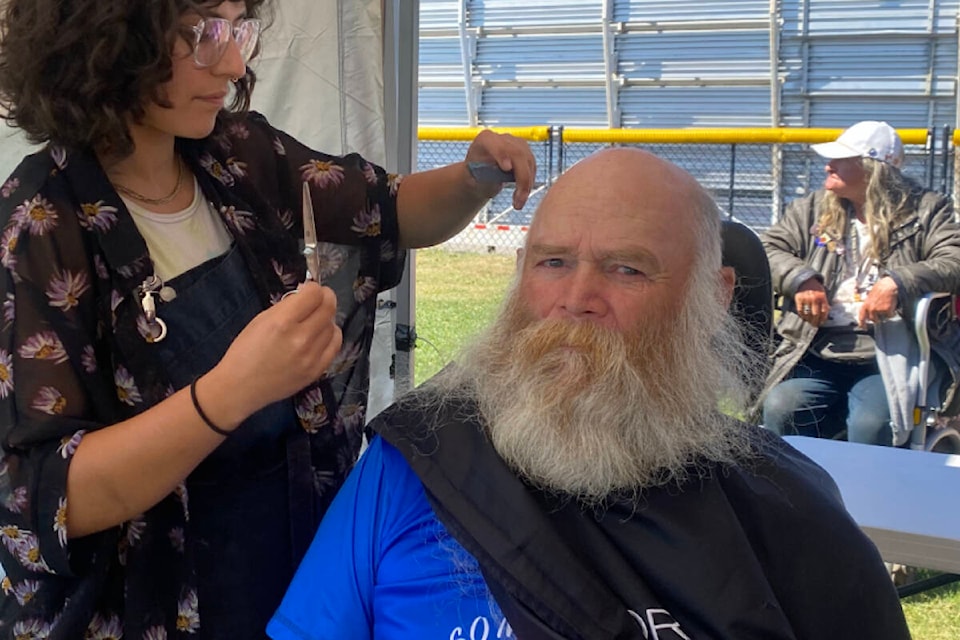 Kurtis Bunnett getting a haircut at Project Reconnect in Royal Athletic Park on Tuesday, Aug. 22. (Ella Matte/News Staff) 