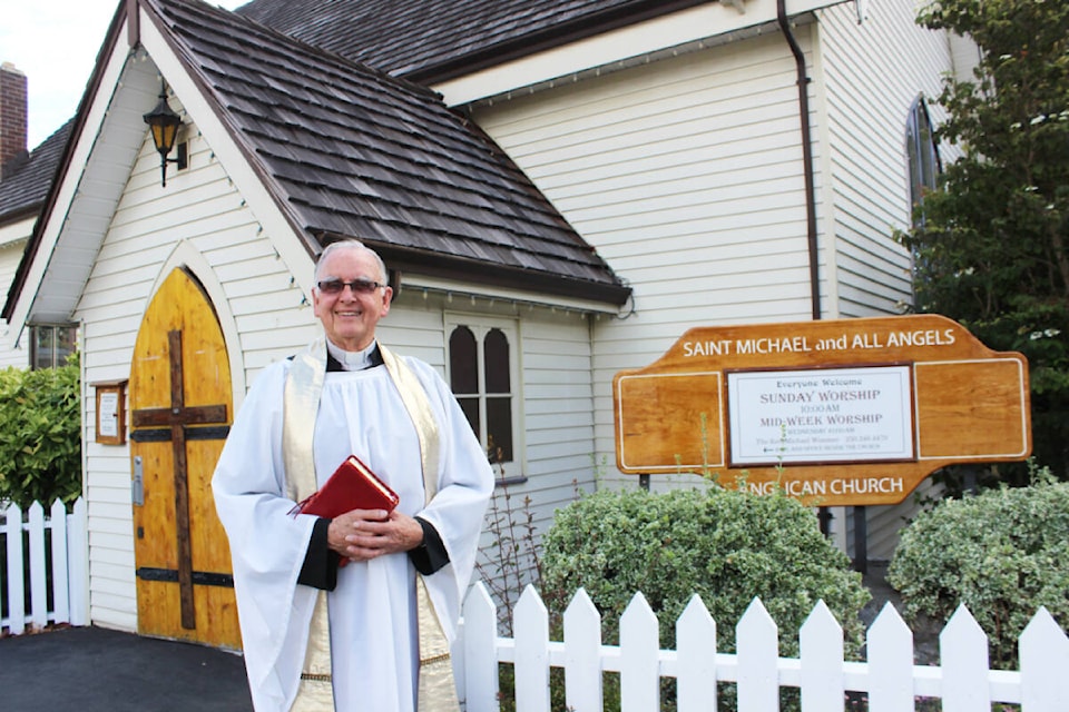 Rev. Michael Wimmer outside St. Michael and All Angels Church in Chemainus where his temporary relief position turned into many more years of service than originally anticipated. (Photo by Don Bodger) 