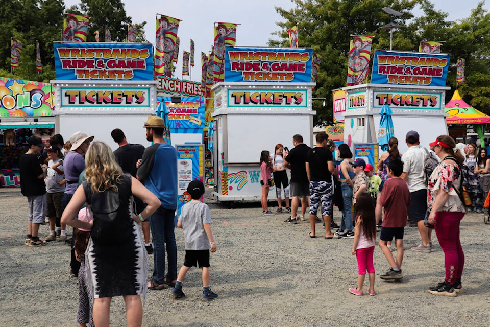 Crowds are lining up to get ride tickets at the Vancouver Island Exhibition. The fair will be open all weekend and will feature activities for all ages. (Bailey Seymour/News Bulletin) 