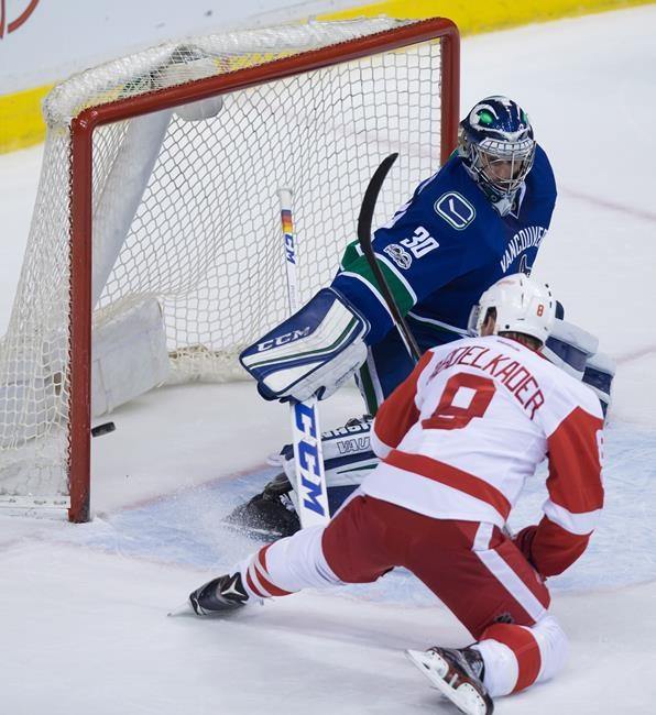 Burrows lifts Canucks into next round with OT goal
