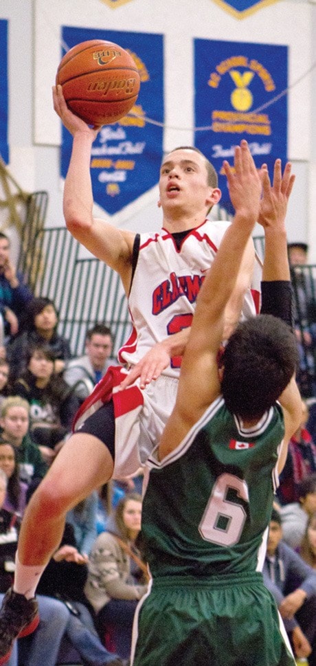 Desmond Slack(21) puts up a shot for Claremont Secondary