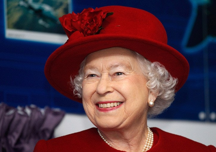 Britain's Queen Elizabeth smiles during a vist to her grandson, Prince William, at RAF Valley, in north Wales