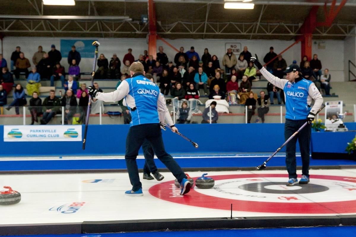 Skip Jim Cotter of Vernon, right, gestures following a shot by teammat Catlin Schnieder during the final of the 2018 belairdirect BC Men’s Curling Championship at Parksville Curling Club Sunday, Feb. 4, 2018. — J.R. Rardon photo