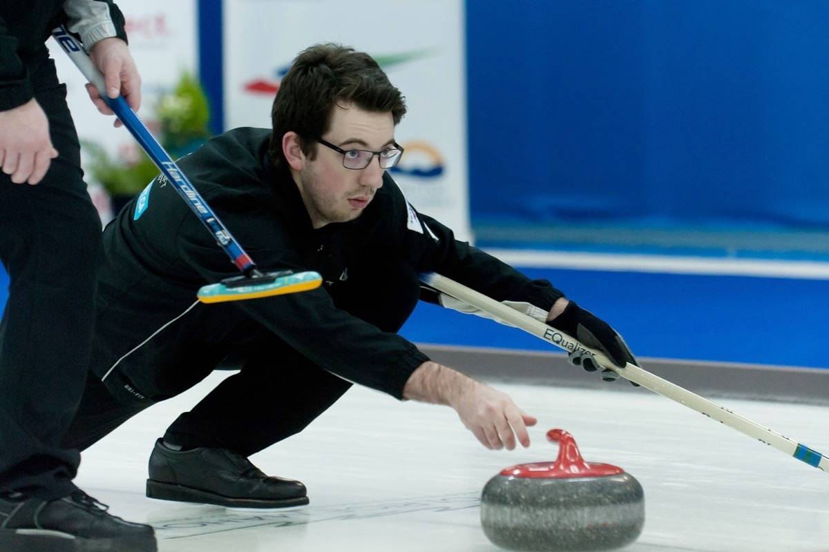 Cameron de Jong, curling third for Victoria Curling Club’s Team Montgomery, releases a shot during the semifinal game of the 2018 belairdirect BC Men’s Curling Championship at Parksville Curling Club Sunday, Feb. 4, 2018. — J.R. Rardon photo