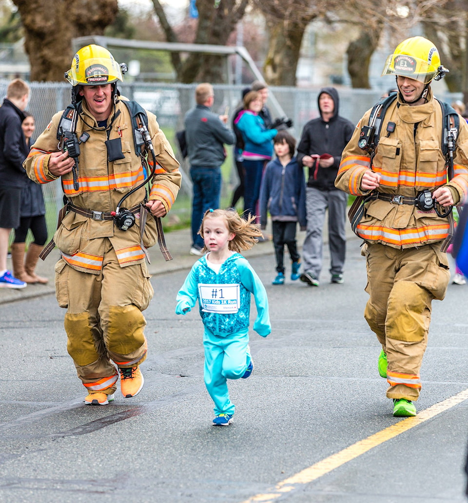 10963251_web1_girl-running-with-firefighters