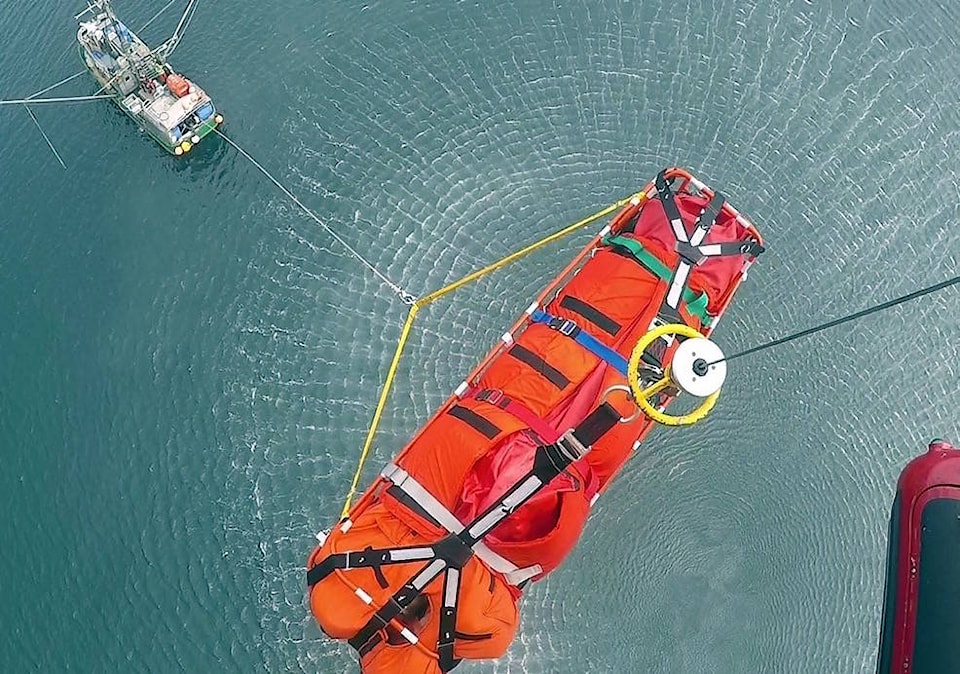 13154921_web1_180815-CVR-M-4---SAR-at-Port-Louis---Graham-Island---Patient-being-hoisted---14-Aug-2018---19-Wing-Public-Affairs-Photo