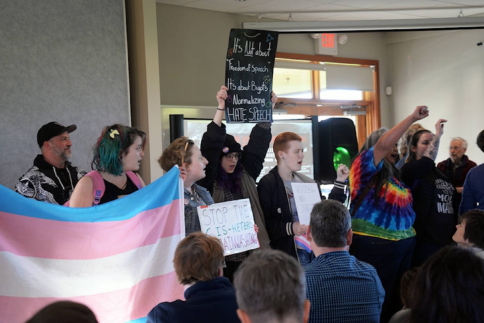 Protestors took over the Erosion of Freedom event at the Windsor Pavilion event, drowning out the speakers with chanting, songs, bells and more. (Nina Grossman/News Staff)