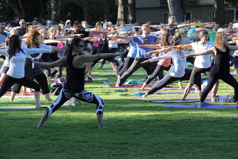 Free yoga draws a crowd at Willows Beach Park. (Oak Bay News file photo)
