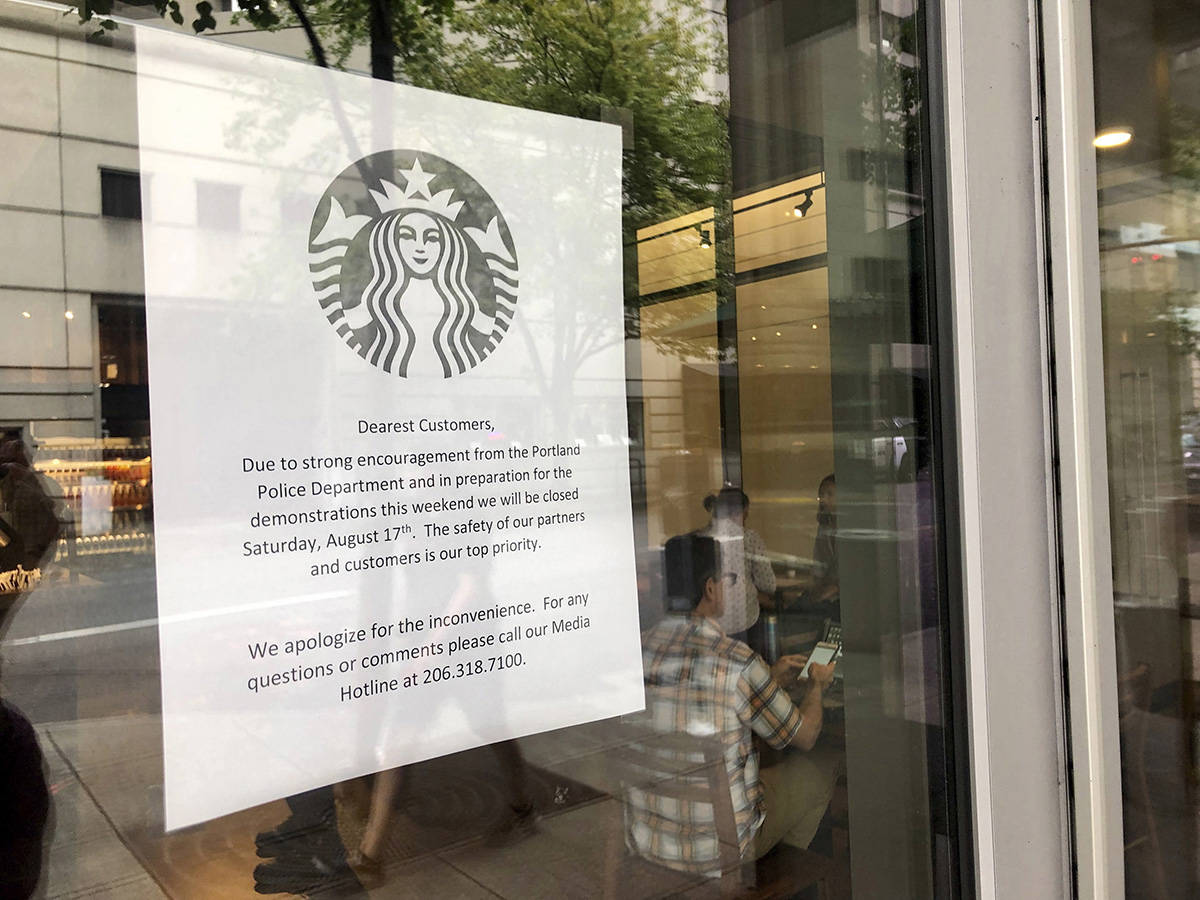 A coming closure sign is posted in the window of a Starbucks Cafe near where a large rally is planned in Portland, Ore., Friday, Aug. 16, 2019. In the past week, authorities in Portland have arrested a half-dozen members of right-wing groups on charges related to violence at previous politically motivated rallies as the liberal city braces for potential clashes between far-right groups and self-described anti-fascists who violently oppose them. (AP Photo/Gillian Flaccus)