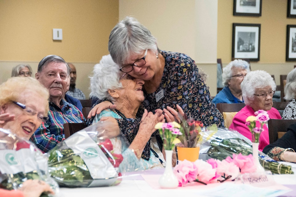 Eleanor Pattison hugs a recreation coordinator at the Wellesley Thursday night. Pattison turned 100 on Oct. 17 and was one of four women celebrated at a special party. (Nina Grossman/News Staff)