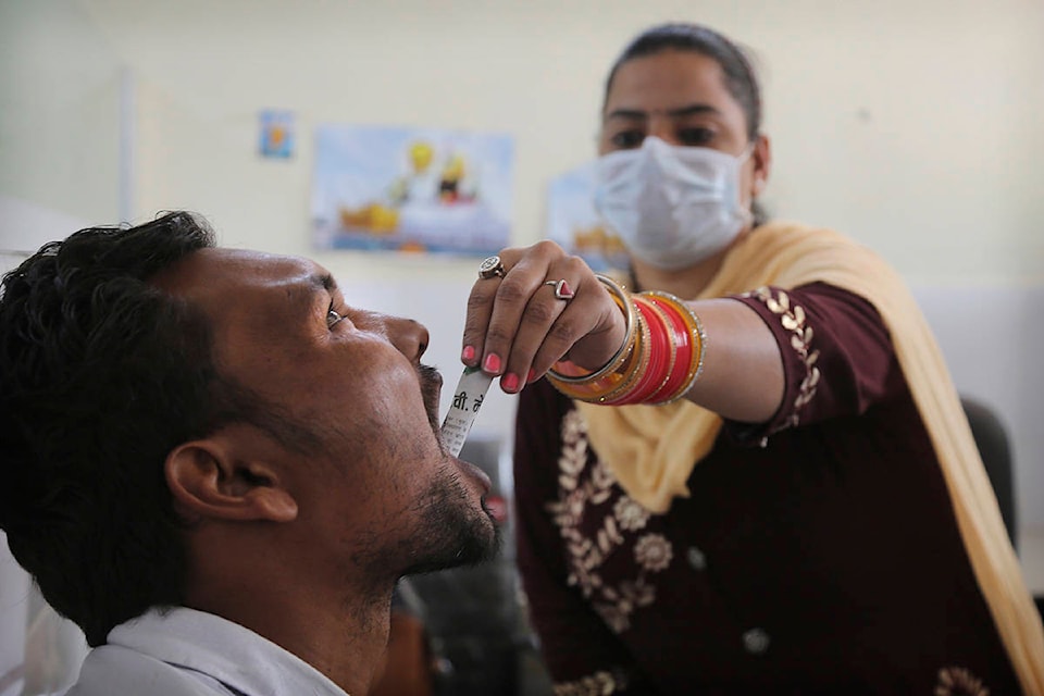 In this Thursday, Oct. 31, 2019, photo, a medic administers medicine to a recovering drug addict at a de-addiction center in Kapurthala, in the northern Indian state of Punjab. Researchers estimate about 4 million Indians use heroin or other opioids, and a quarter of them live in the Punjab, India’s agricultural heartland bordering Pakistan. These pills, the world had been told, were safer than the OxyContins, the Vicodins, the fentanyls that had wreaked so much devastation. But now they are the root of what the United Nations named “the other opioid crisis,” an epidemic featured in fewer headlines than the American one, as it rages through the most vulnerable places on the planet. (AP Photo/Channi Anand)
