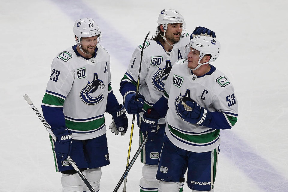 20113730_web1_200112-IFD-Canucks-wild