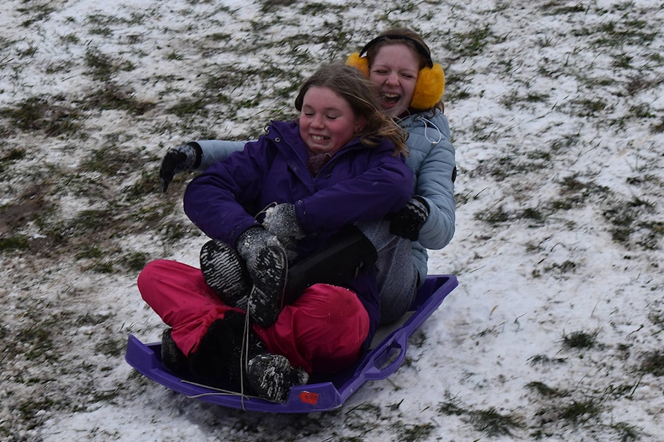 20150344_web1_sledding_girls_deep_cove