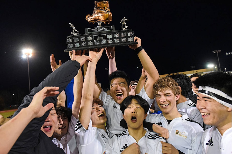 St. Michaels University School’s rugby team lifts the 2020 Gareth Rees Boot following the team’s Boot Game win over Oak Bay on Thursday, March 12. (Kyle Slavin/St. Michaels University School)