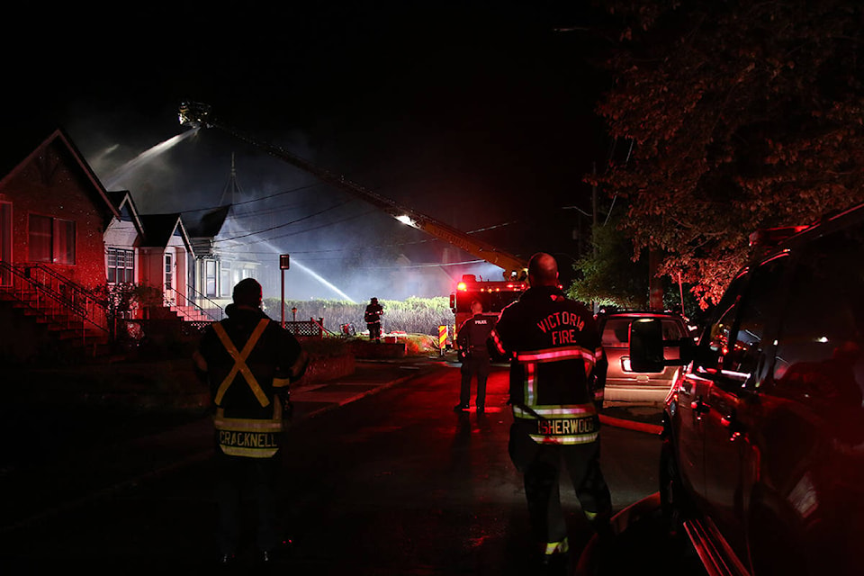 Fire crews working to put out a fire in the 200-block of Robert Street that started at around 8:40 p.m. on April 28. (Kendra Crighton/News Staff)