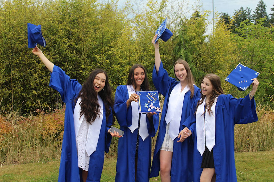 Belmont Secondary graduates Jasmyn Loo, Jacklyn Halaburda, Ashley Bilachand Isabella Wheaton celebrate the end of their high school careers. (Shalu Mehta/News Staff)